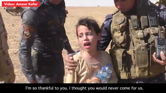  Rescued... The little girl is rescued by Iraqi troops