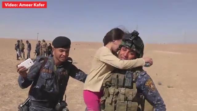  Hug for heroes... She embraces her liberator