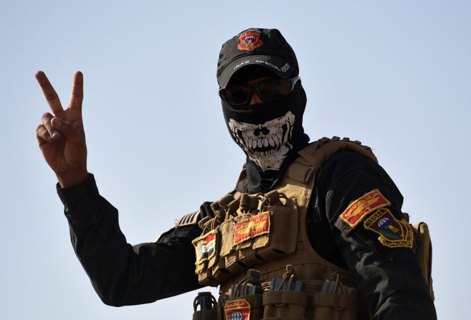  An Iraqi soldier poses for a photo during the offensive to recapture the city of Mosul