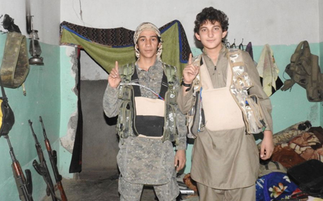  A pair of teens doing a jihadi gesture