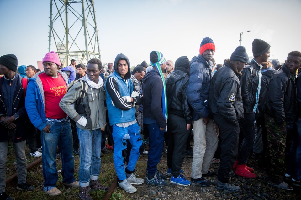  Young unaccompanied migrants who are hoping to come to the UK wait to be processed after leaving the Jungle Camp