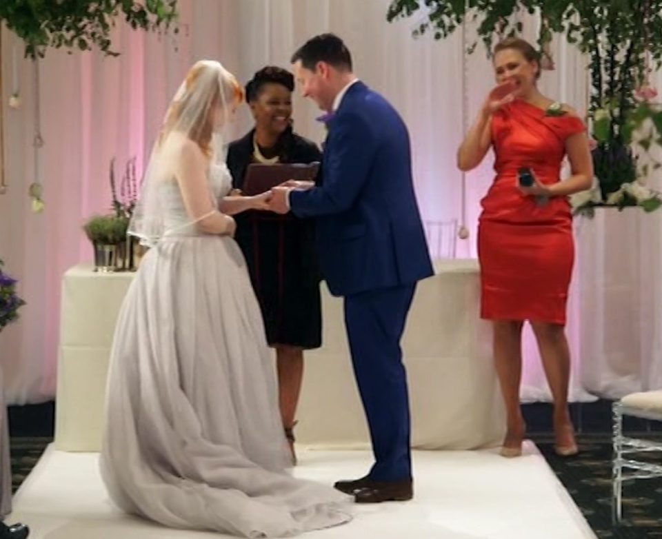 Adam ties the knot to Caroline, while his female best man looks on 