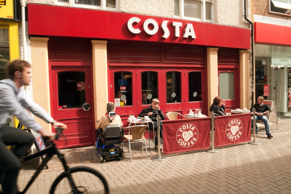 People drinking coffee at Costa Coffee, central Norwich, Norfolk, UK