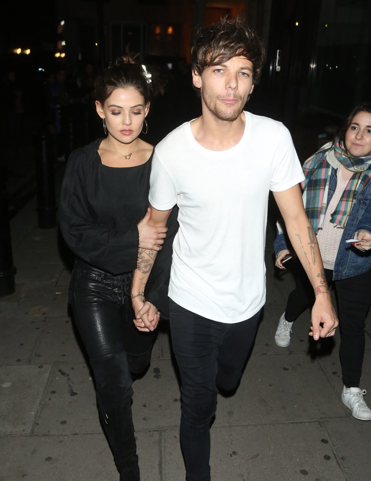  Louis and girlfriend Danielle braced the cold as they left the event