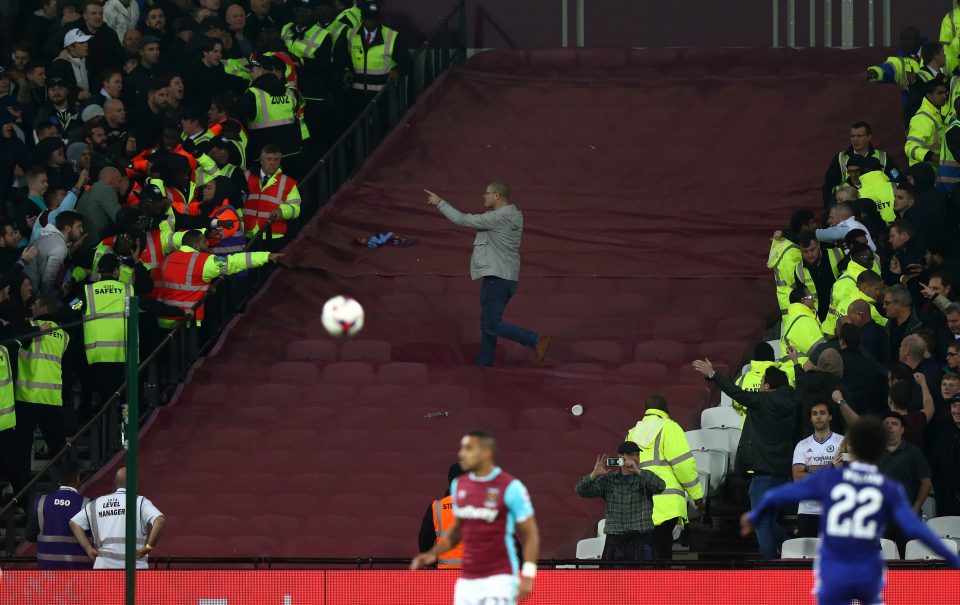 A fan breaks through segregation during West Ham's EFL Cup win over Chelsea