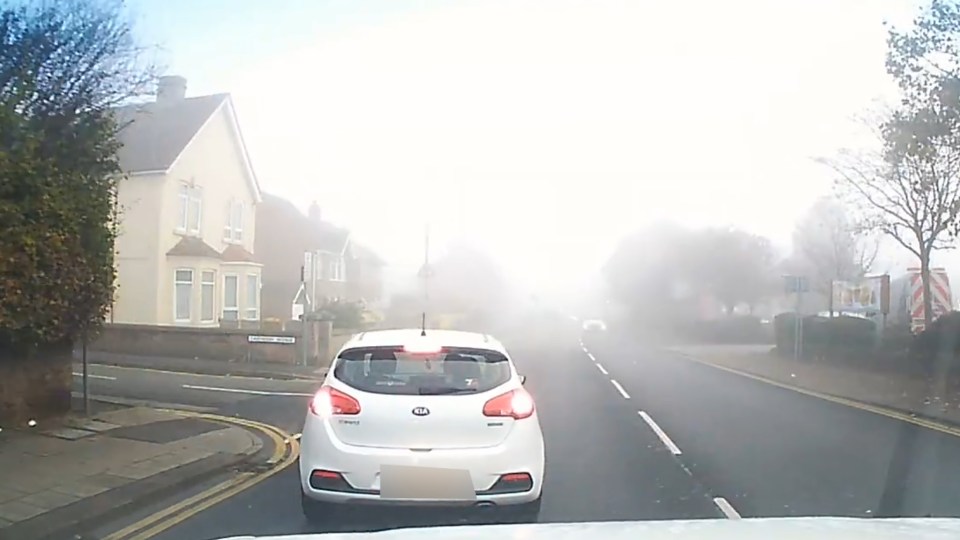  Pete follows white Kia as it turns down a residential street in Northamptonshire