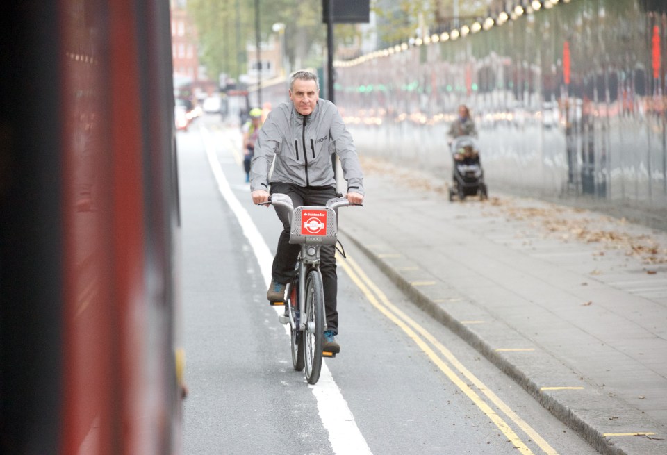  Pictured here, the recognisable presenter cycles down a London street