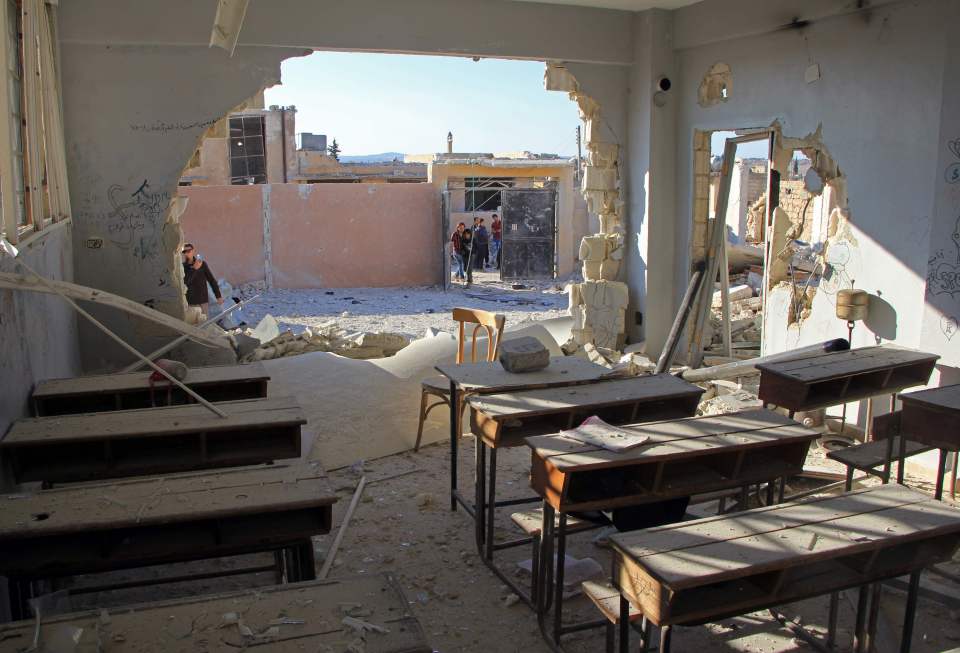  Damaged classroom after it was hit during an air strike in the village of Hass, in Syria's rebel-held Idlib province