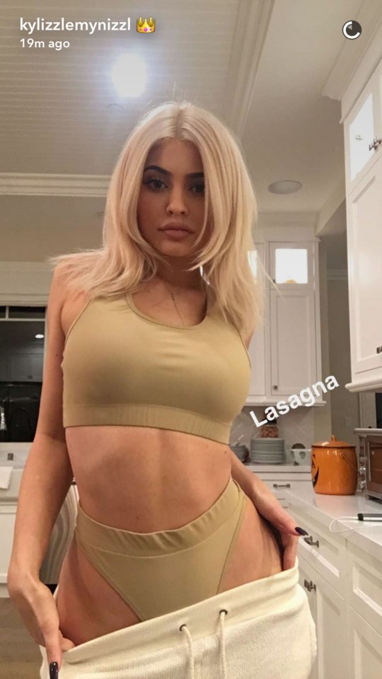 Kylie did a strip tease in her kitchen as she was cooking