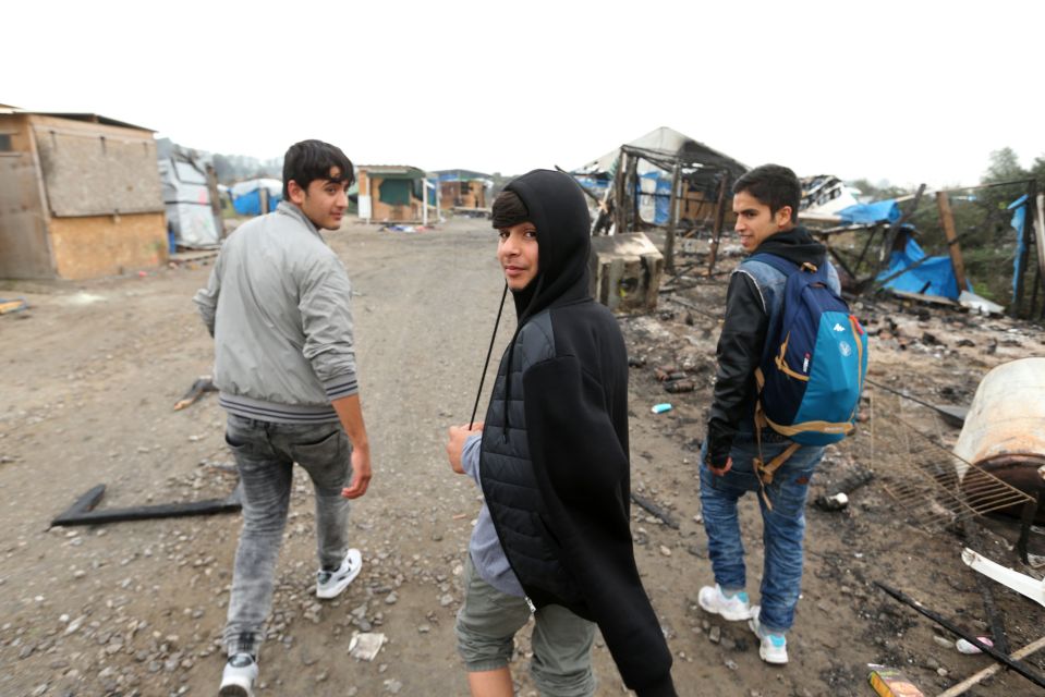  Youngsters walking through the streets of the half-demolished Jungle