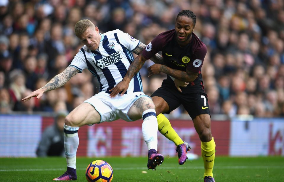 James McClean battles with Manchester Citys Raheem Sterling 