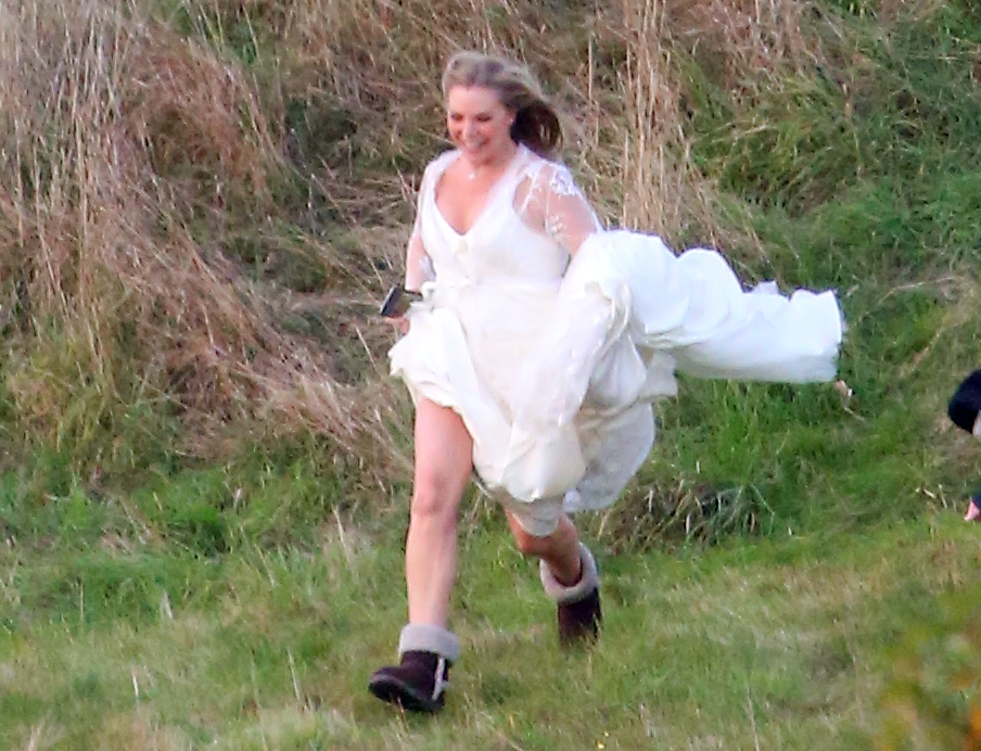  Bride on the run . . . doomed Ronnie Mitchell makes a dash for it in expensive white gown