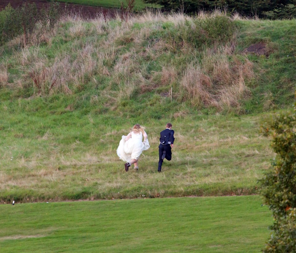  Great escape . . . Ronnie and star Jay Mitchell dash up a hill during filming