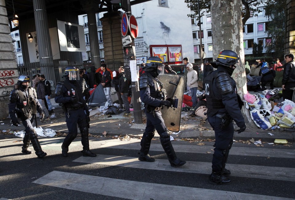  Riot police officers were sent in to protect demolition workers clearing the tents