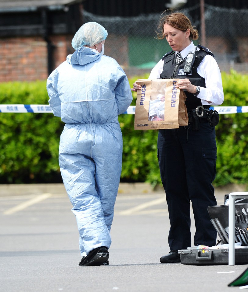 Police and forensic teams investigate at the Sainsbury's store in Hampton