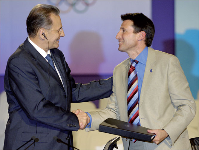  IOC President Jacques Rogge (left) shakes hands with Sebastian Coe, chairman of the London 2012 bid, after the contract is signed and accepted.