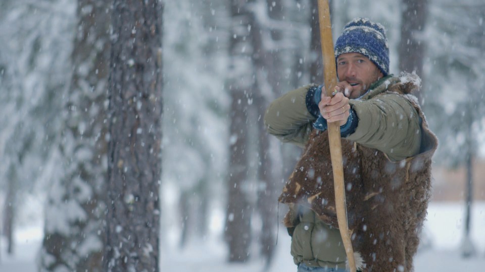 Ben Fogle shoots a bow and arrow