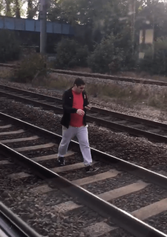 Walking the line: The trespasser strolled down the tracks in what was said to be a senseless protest against ticket prices