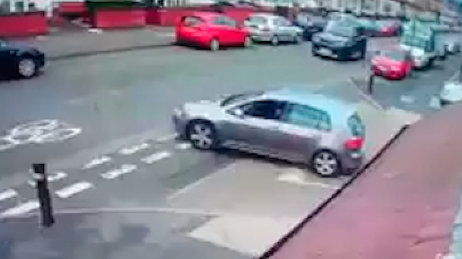  The silver car can be seen pulling on to the street before the fight