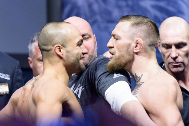 Eddie Alvarez and Conor McGregor exchange pleasantries at the staredown at the UFC 205 ceremonial weigh-ins