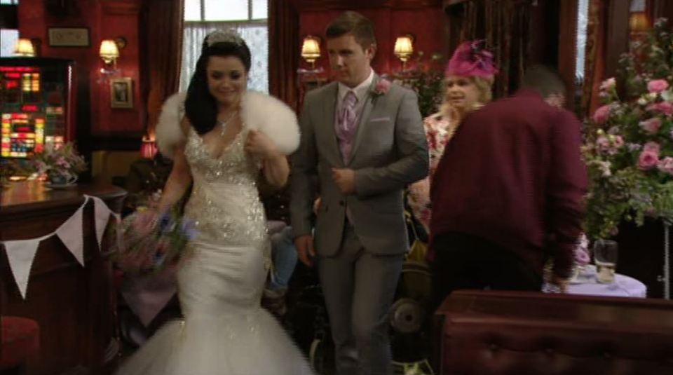 The veil was still off as she walked into the pub again with Lee