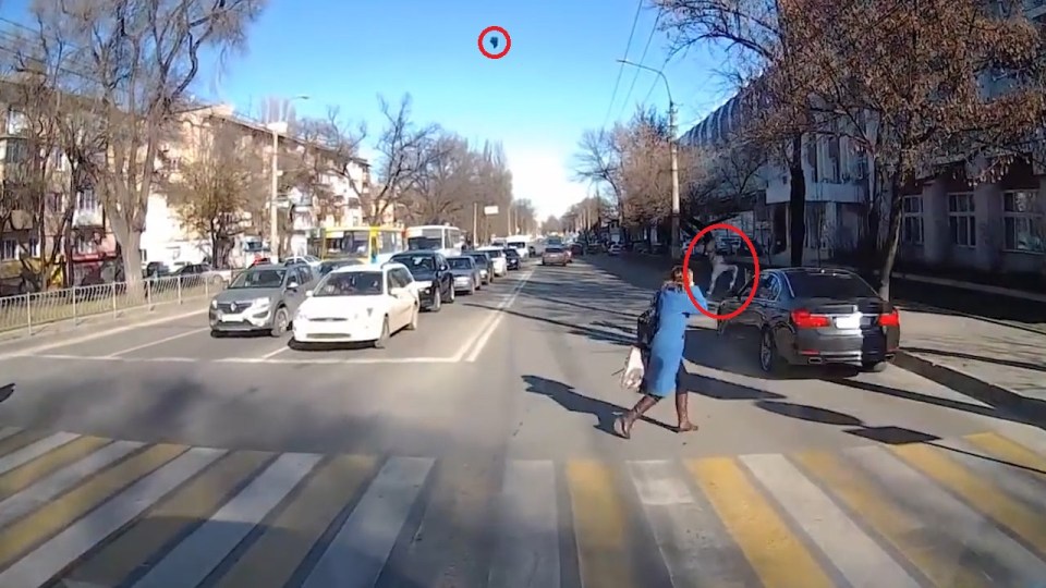  The little boy goes flying, and his shoe can be seen mid-air against the blue sky