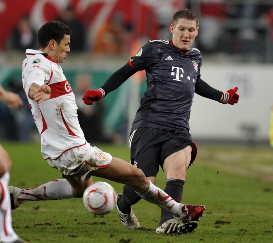 GERMANY : RESTRICTIONS / EMBARGO - ONLINE CLIENTS MAY USE UP TO SIX IMAGES DURING EACH MATCH WITHOUT THE AUTHORISATION OF THE DFL. NO MOBILE USE DURING THE MATCH AND FOR A FURTHER TWO HOURS AFTERWARDS IS PERMITTED WITHOUT THE AUTHORISATION OF THE DFL. Stuttgart's Dutch defender Khalid Boulahrouz (L) tackles Munich's midfielder Bastian Schweinsteiger during the DFB German Cup football match Vfb Stuttgart vs FC Bayern Munich in the southern German city of Stuttgart on December 22, 2010. Bayern Munich won the match 3-6. AFP PHOTO / THOMAS KIENZLE (Photo credit should read THOMAS KIENZLE/AFP/Getty Images)