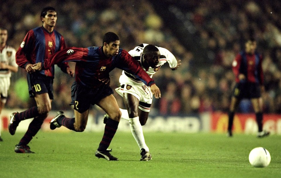 25 Nov 1998: Andy Cole of Manchester United takes on Michael Reiziger of Barcelona during the UEFA Champions League match at the Nou Camp in Barcelona, Spain. Cole scored as the game ended 3-3. Mandatory Credit: Shaun Botterill /Allsport