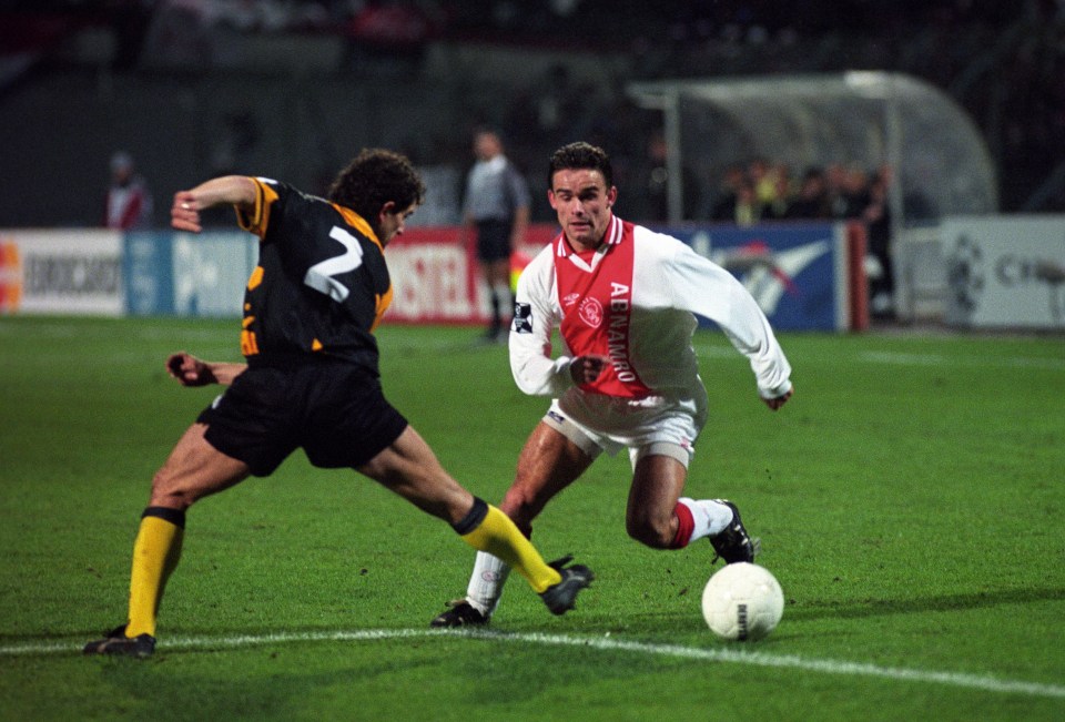 (L-R) Georgios Agorogiannis of AEK Athens, Marc Overmars of Ajax during the Champions League match between Ajax Amsterdam and AEK Athens on december 12, 1994 at the Olympic Stadium in Amsterdam, the Netherlands (Photo by VI Images via Getty Images)