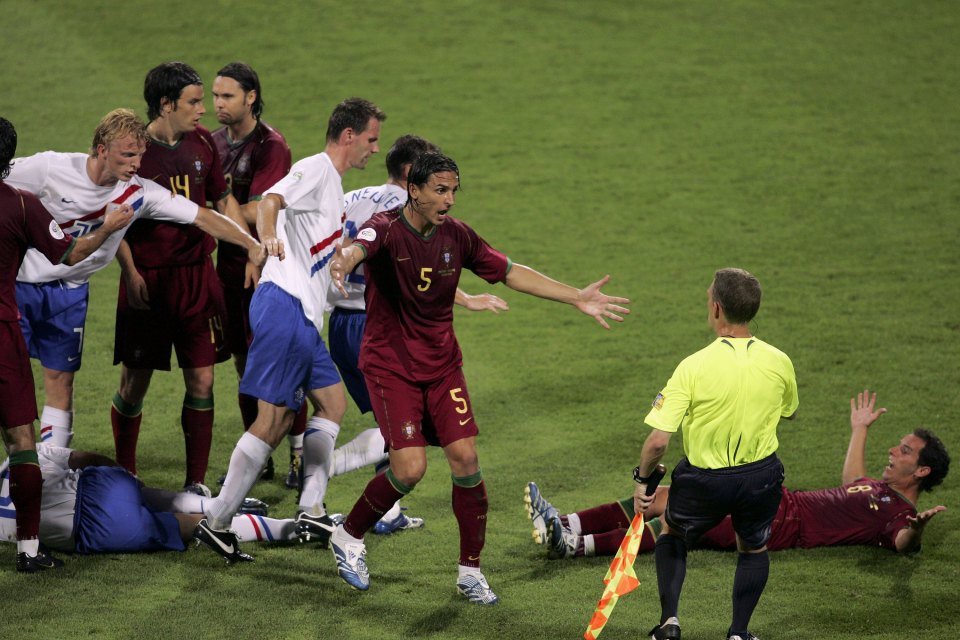  Portugal players complain to the referee after yet another foul by Holland