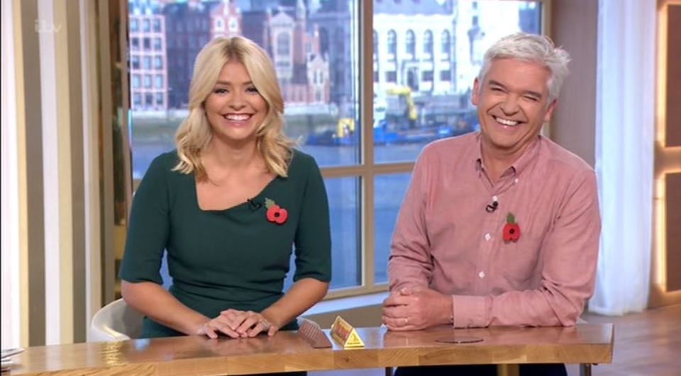  Holly couldn't keep the smile off her face as she discussed Harry's romance