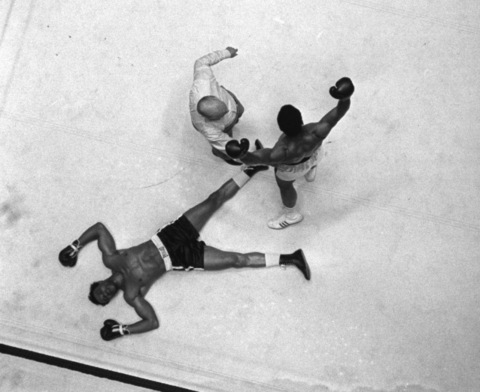 FILE-- Cleveland Williams is spread eagled on the canvas as refree Harry Kessler sends Cassius Clay to a neutral corner during their heavyweight bout at the Astrodome in Houston, in this Nov. 14, 1966 photo. Williams died of injuries in an auto-pedestrian accident Friday Sept. 10, 1999 in Houston. (AP Photo/File)