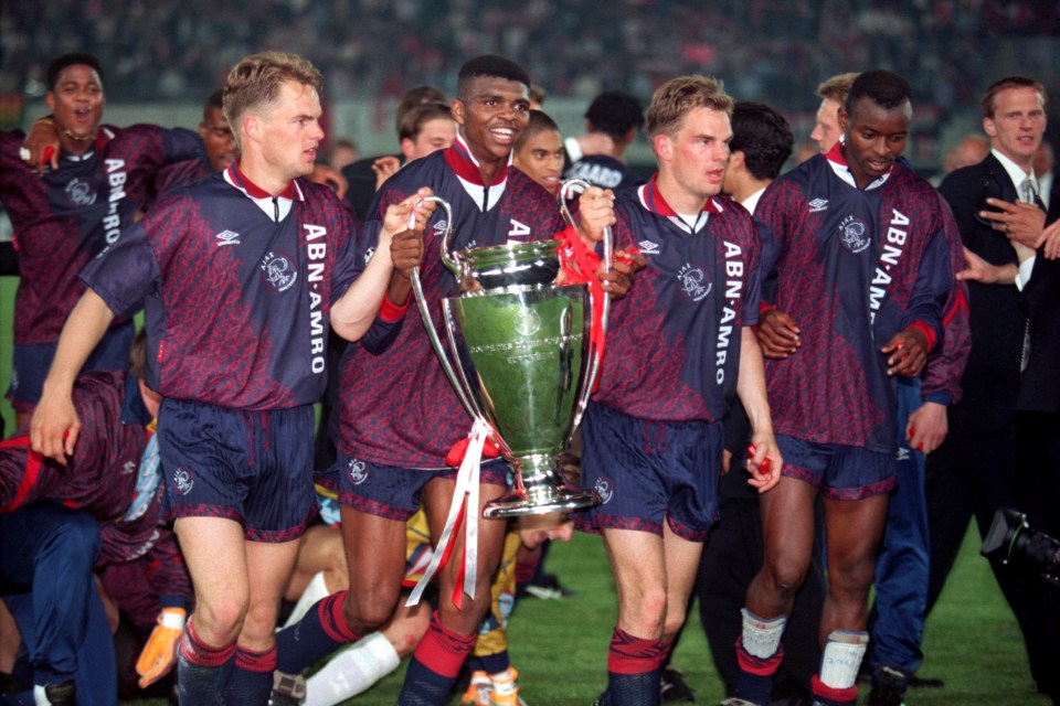 (L-R) Ajax's Frank de Boer, Nwankwo Kanu, Ronald de Boer and Finidi George celebrate with the European Cup