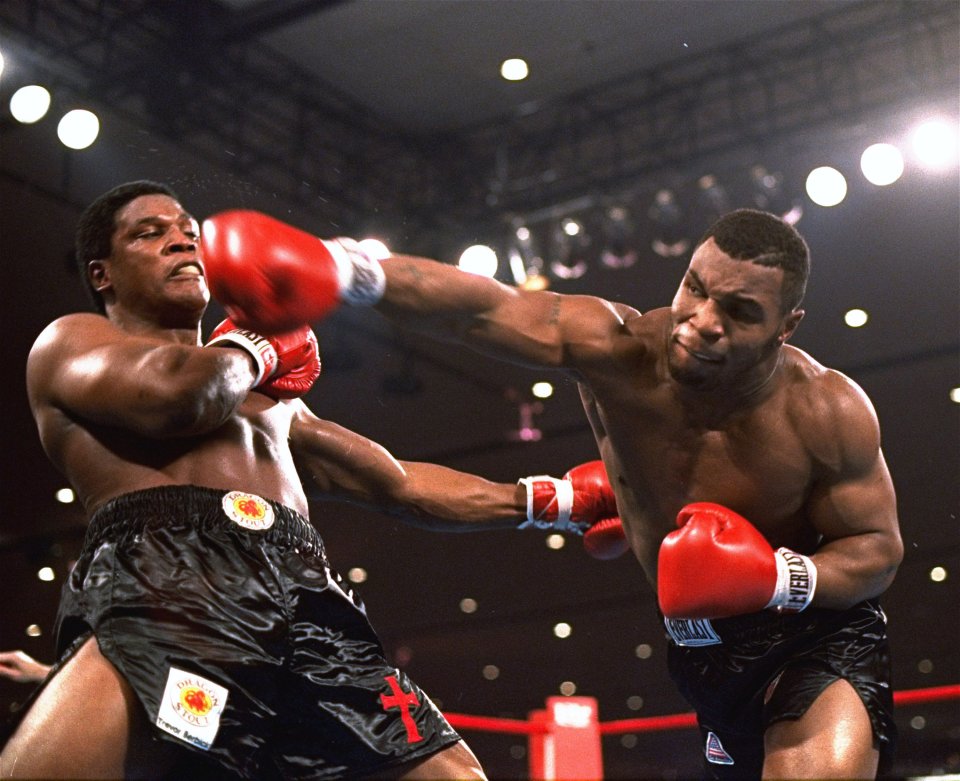 Mike Tyson delivers a powerful blow to Trevor Berbick 