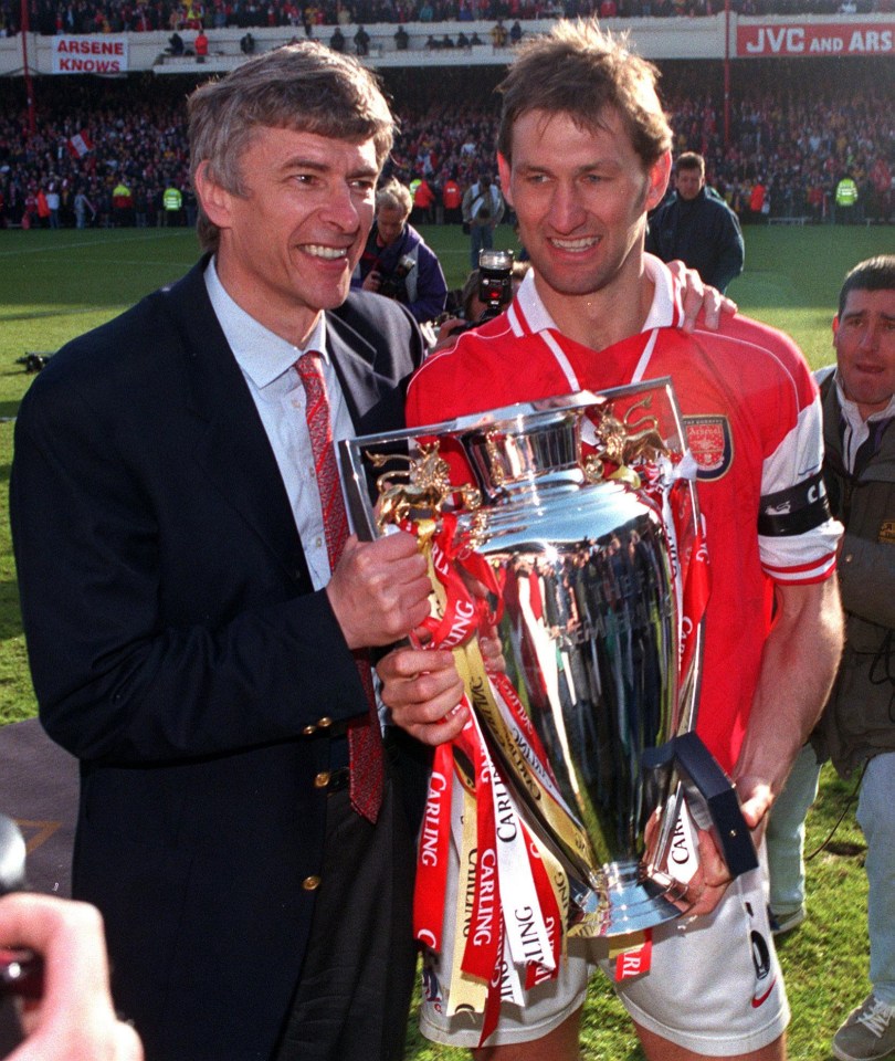 File photo dated 03/05/1998 of Arsenal manager Arsene Wenger (left) and captain Tony Adams hold the FA Carling Premiership League trophy.