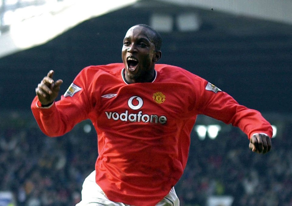 Manchester United's Dwight Yorke wheels away after scoring his hat-trick in a 6-1 win