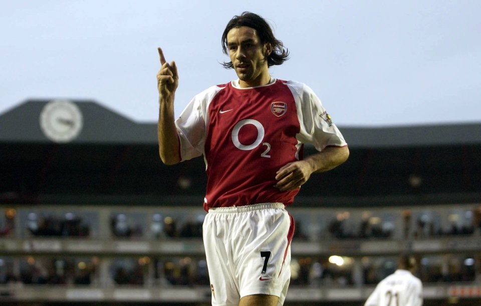 Robert Pires celebrates Arsenal's first half goal against Aston Villa during their FA Barclaycard Premiership match at Arsenal's Highbury stadium, London, Saturday 30 November 2002. PA Photo: Chris Young. THIS PICTURE CAN ONLY BE USED WITHIN THE CONTEXT OF AN EDITORIAL FEATURE. NO WEBSITE/INTERNET USE UNLESS SITE IS REGISTERED WITH FOOTBALL ASSOCIATION PREMIER LEAGUE.