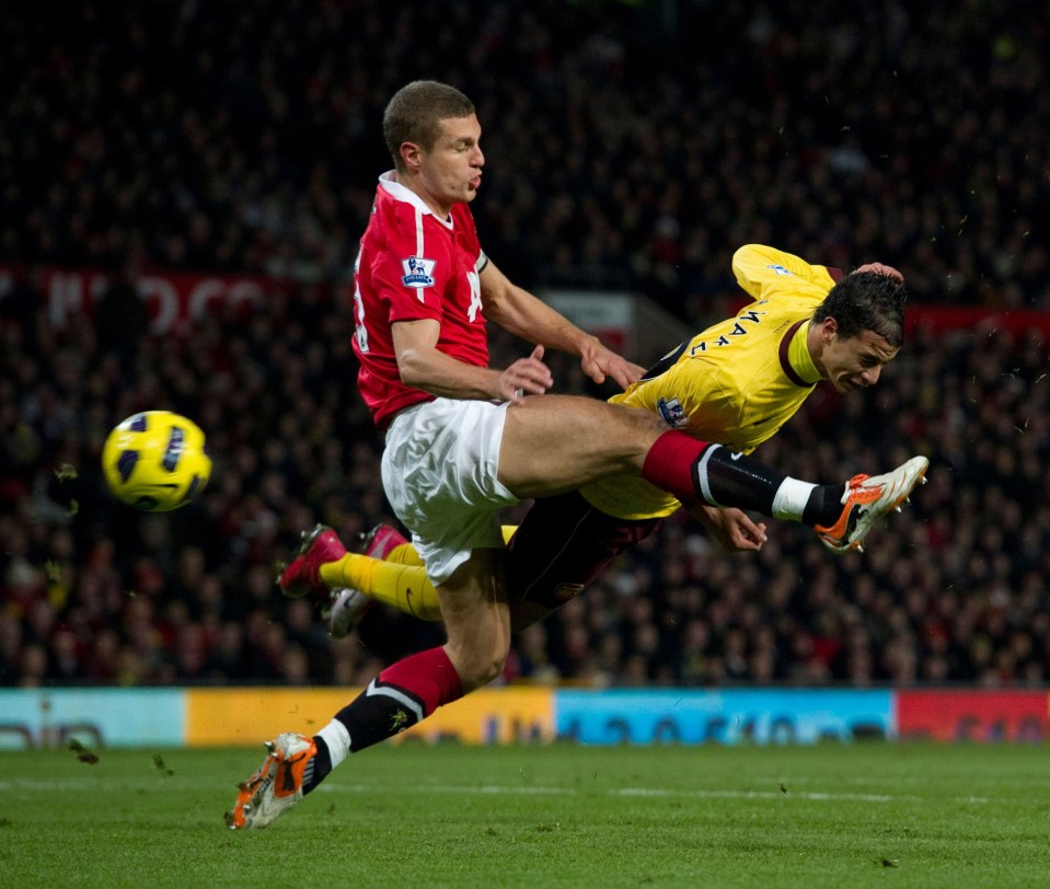 13.12.10. Manchester United v Arsenal. Nemanja Vidic and Marouane Chamakh. ( Bradley Ormesher/The Times )