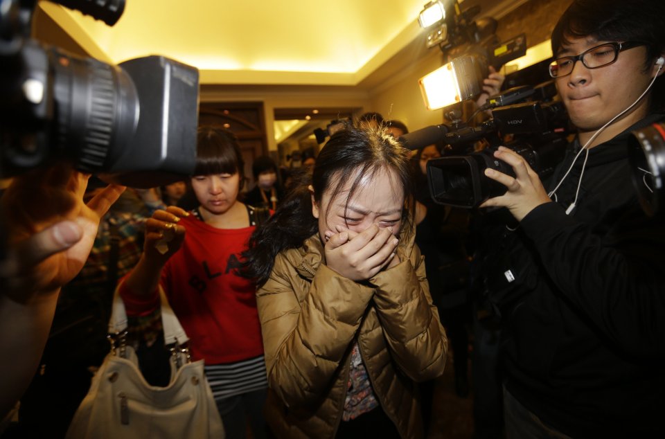 Mourning... A grief-stricken relative of one of the lost passengers