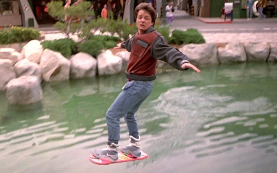 Marty whizzes over the water on his hoverboard 