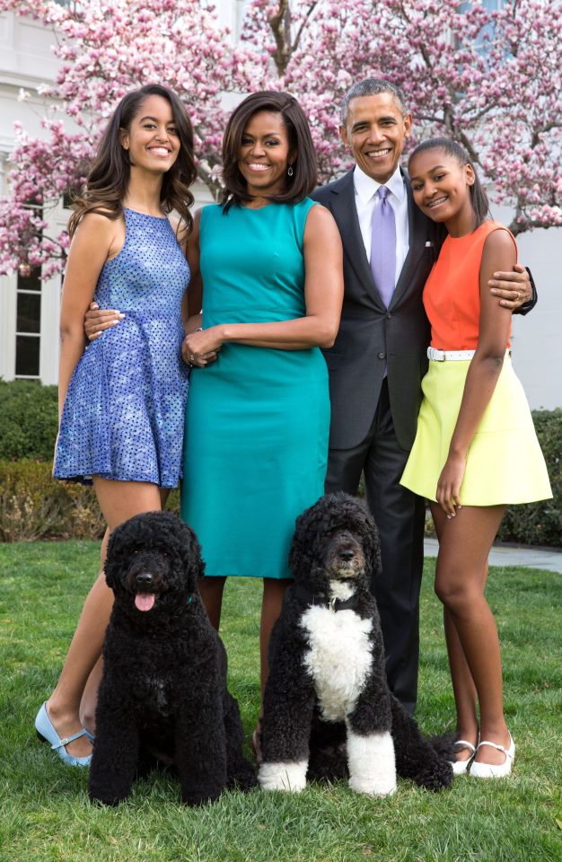  The happy family along with their dogs Bo and Sunny will be staying put in DC until younger daughter Sasha, right, graduates