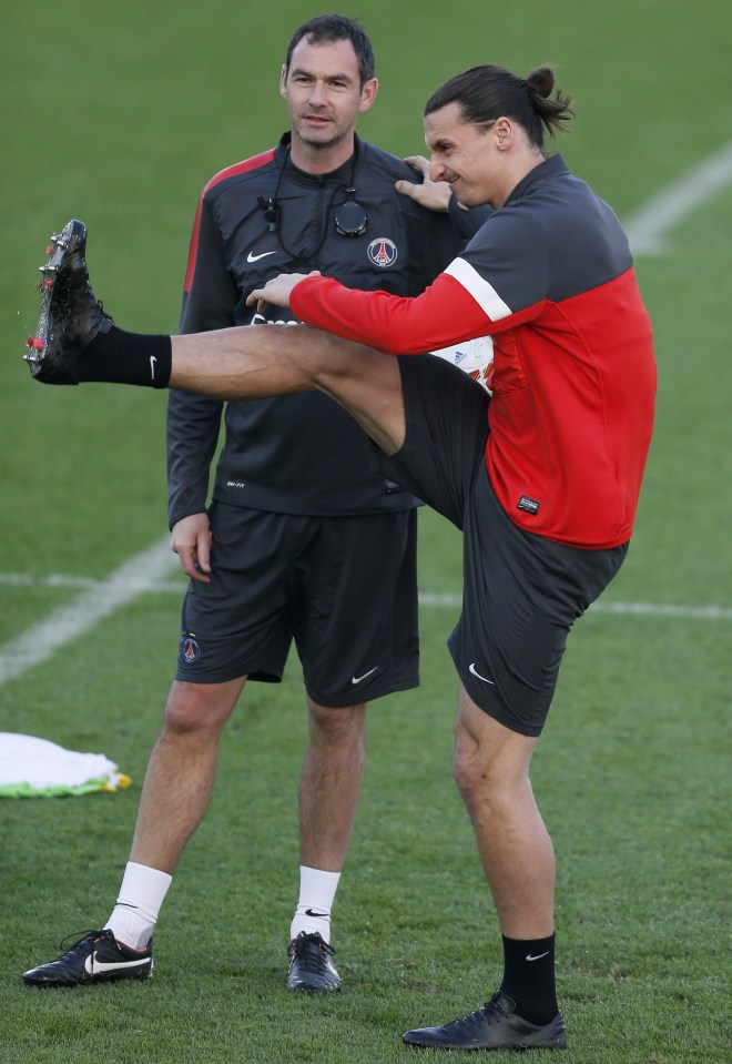 Paris Saint-Germain's Ibrahimovic takes part in training session next to assistant coach Clement