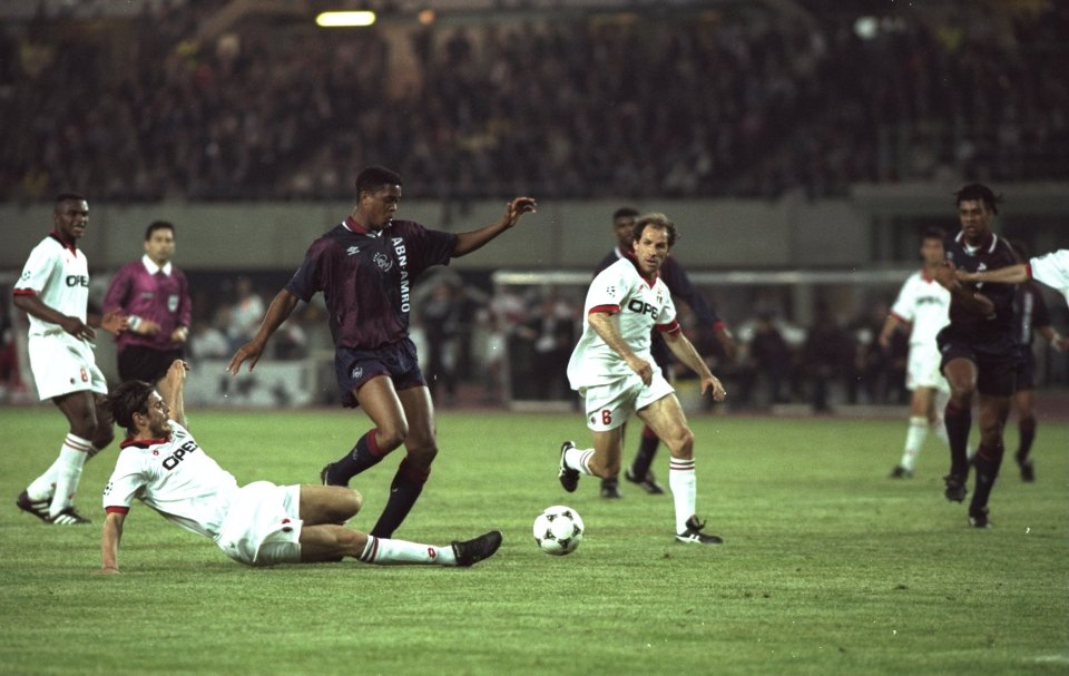 24 May 1995: Patrick Kluivert (centre left) of Ajax robs Franco Baresi (left) of AC Milan of the ball during the European Cup Final in Vienna, Austria. Ajax won the match 1-0. Mandatory Credit: Clive Brunskill/Allsport