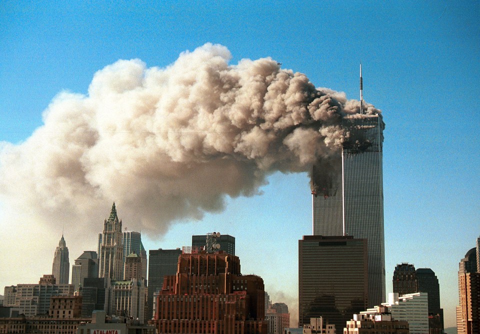  With smoke billowing from the World Trade Center, Tower 7 can be seen directly in front of the Twin Towers