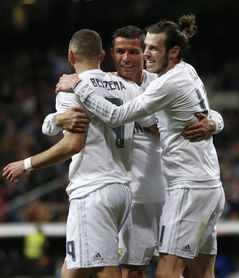 MADRID, SPAIN - MARCH 20: Gareth Bale (R) of Real Madrid celebrates after scoring with his teammates Karims Benzema (L) and Cristiano Ronaldo (C) during the La Liga match between Real Madrid CF and Sevilla FC at Estadio Santiago Bernabeu on March 20, 2016 in Madrid, Spain. (Photo by Pedro Castillo/Real Madrid via Getty Images)