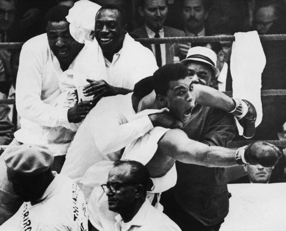 27 Feb 1964: Cassius Clay (Muhammad Ali) flies around the ring after beating Sonny Liston in the seventh round of the World Heavyweight Title bout in Miami Beach, Florida, USA. It was during these scenes that Clay claimed, "I am the Greatest" and "I shook up the World". Mandatory Credit: Allsport Hulton/Archive