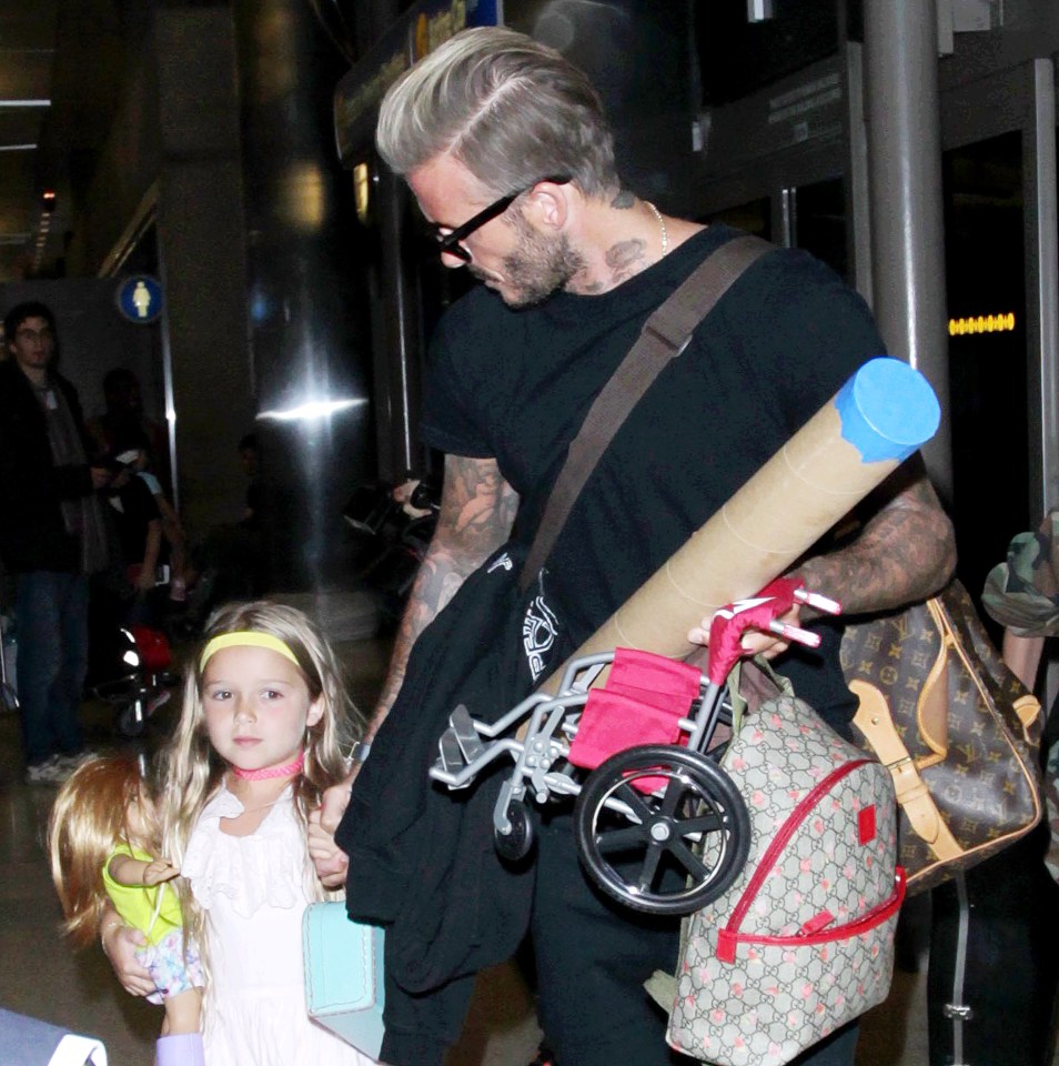  Dad of the year .... David Beckham dotes on his daughter Harper