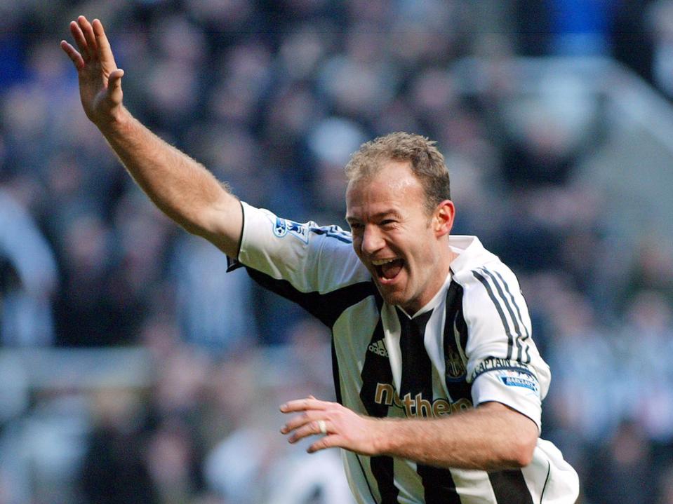 Alan Shearer holds his arm aloft in his famous goal scoring celebration 