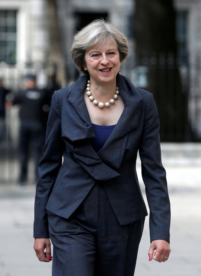 Britain's Prime Minister Theresa May walks to a meeting at the Ministry of Defence in London