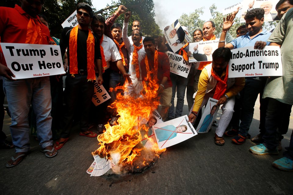  They burn pictures of Democrat candidate Hillary Clinton